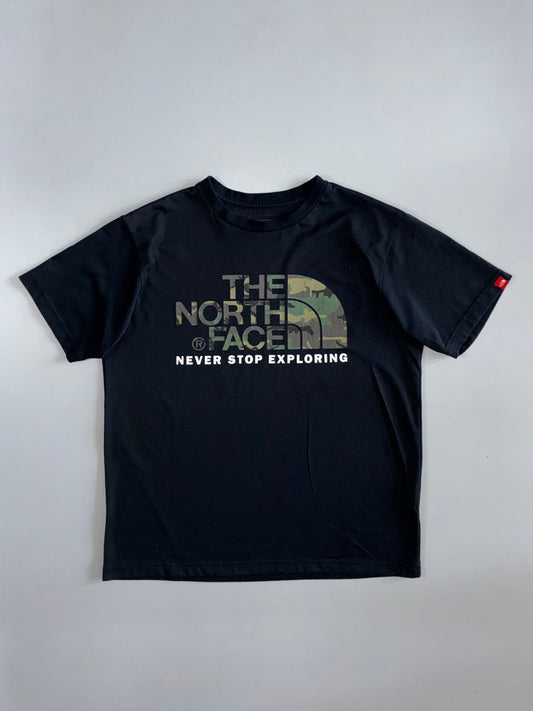 The North Face “Never Stop Exploring” Camo Logo Tee — Black (Japan) (M)