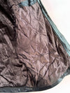 The label  "Genuine Leather" with an eagle (XL)