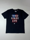 Adidas “Three Stripe Life” USA Flag Graphic Tee – Black (L)