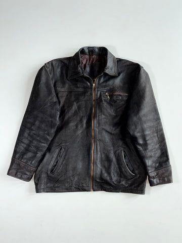 The label  "Genuine Leather" with an eagle (XL)