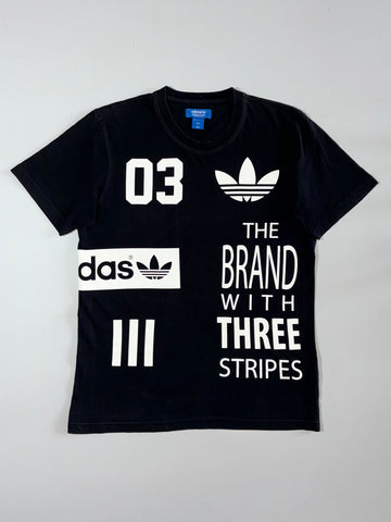 Adidas “The Brand With Three Stripes” Graphic Tee Black (M)